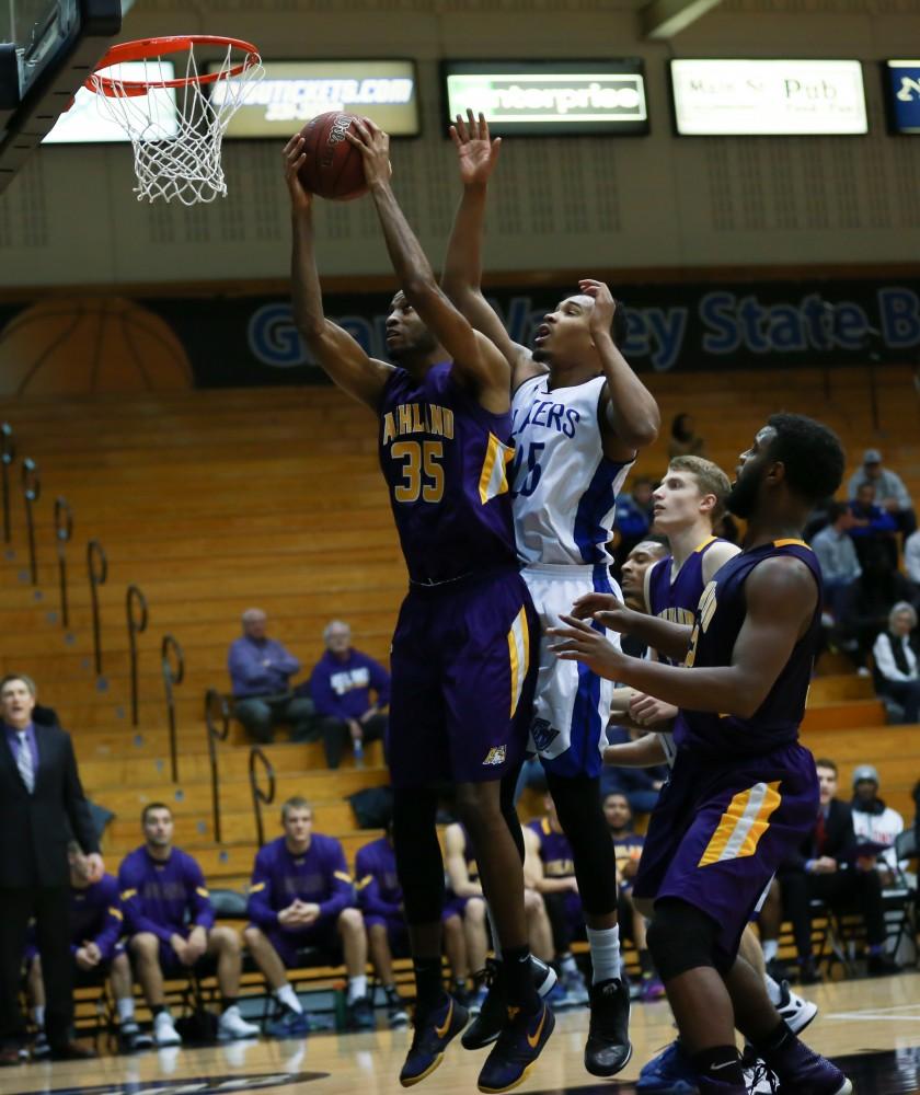 GVL / Kevin Sielaff - Chaz Rollins (25) loses an offensive board.  The Lakers fall to the Eagles of Ashland University in a tough overtime loss Dec. 3 in Allendale. The final score was 76-72.