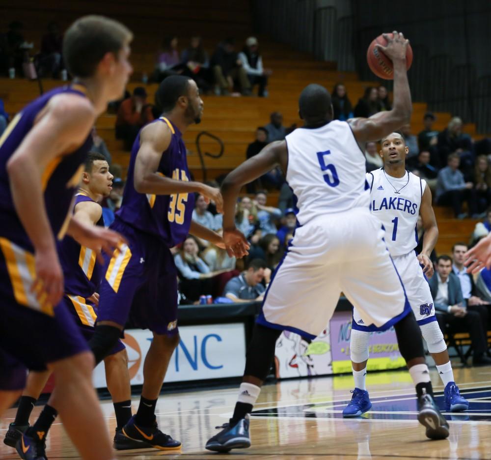 GVL / Kevin Sielaff - Aaron Hayes (1) completes a pass to Trevin Alexander (5).  The Lakers fall to the Eagles of Ashland University in a tough overtime loss Dec. 3 in Allendale. The final score was 76-72.