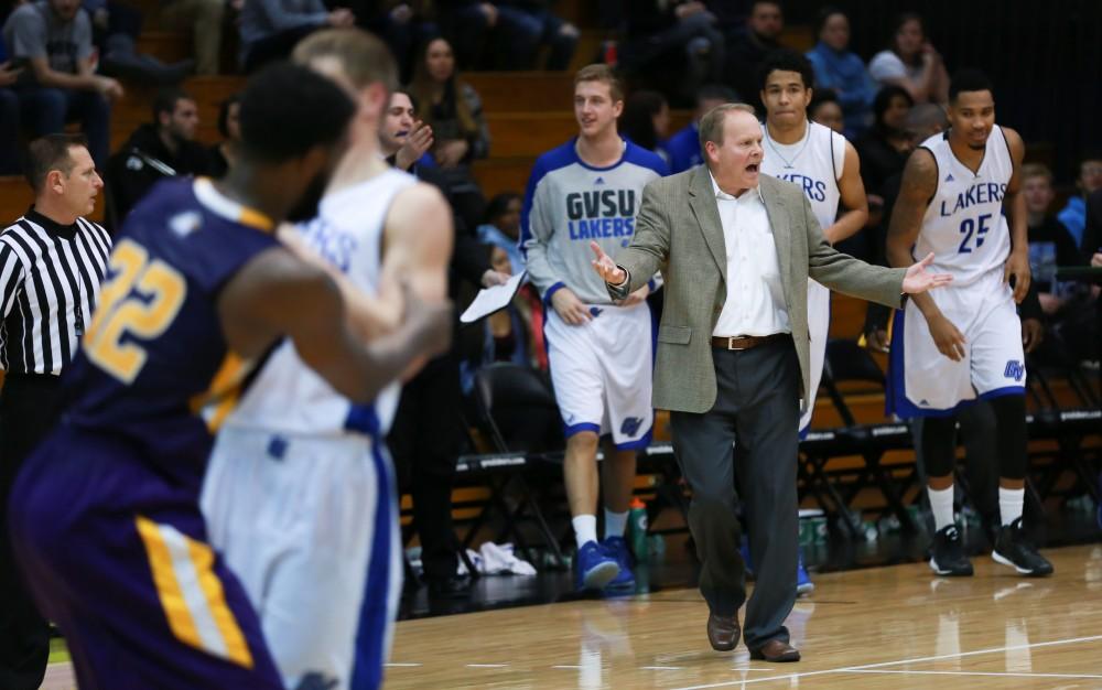 GVL / Kevin Sielaff - Head coach Ric Wesley storms out onto the court as halftime begins.  The Lakers fall to the Eagles of Ashland University in a tough overtime loss Dec. 3 in Allendale. The final score was 76-72.