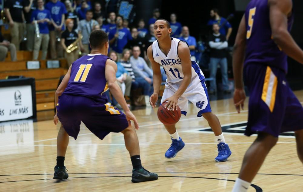 GVL / Kevin Sielaff - Myles Miller (12) dribbles the ball up court.  The Lakers fall to the Eagles of Ashland University in a tough overtime loss Dec. 3 in Allendale. The final score was 76-72.