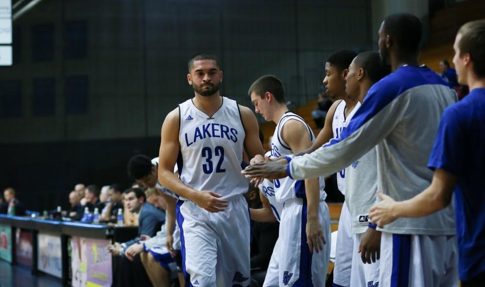 GVL / Kevin Sielaff - Ricardo Carbajal (32) returns to the bench after a tough shift.  The Lakers fall to the Eagles of Ashland University in a tough overtime loss Dec. 3 in Allendale. The final score was 76-72.