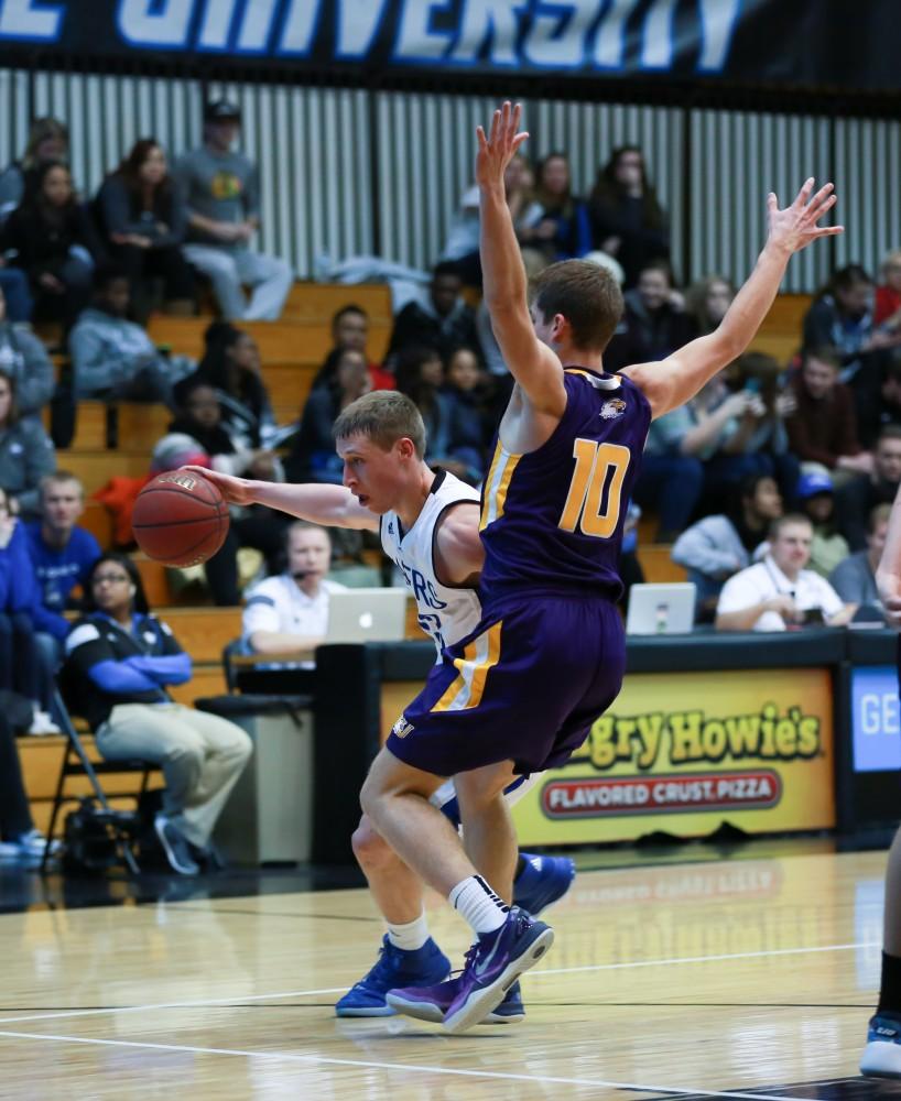 GVL / Kevin Sielaff - Luke Ryskamp (23) drives hard down the lane.  The Lakers fall to the Eagles of Ashland University in a tough overtime loss Dec. 3 in Allendale. The final score was 76-72.