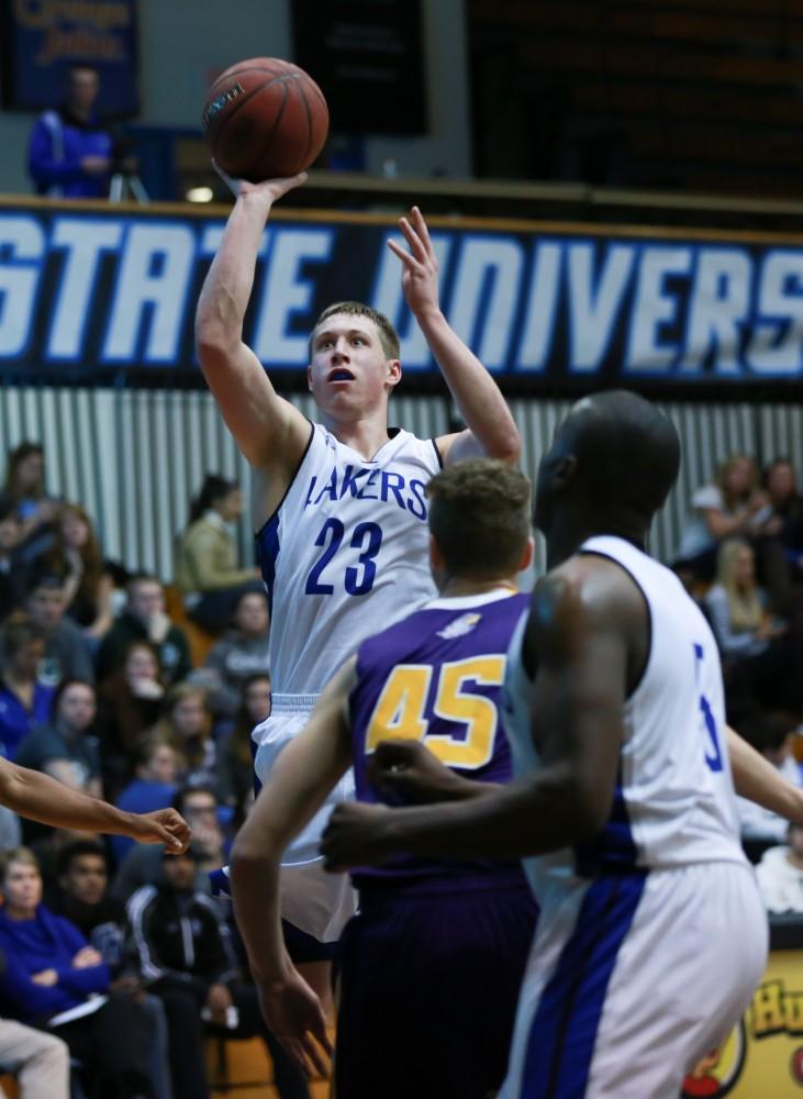 GVL / Kevin Sielaff - Luke Ryskamp (23) steps up for a shot.  The Lakers fall to the Eagles of Ashland University in a tough overtime loss Dec. 3 in Allendale. The final score was 76-72.