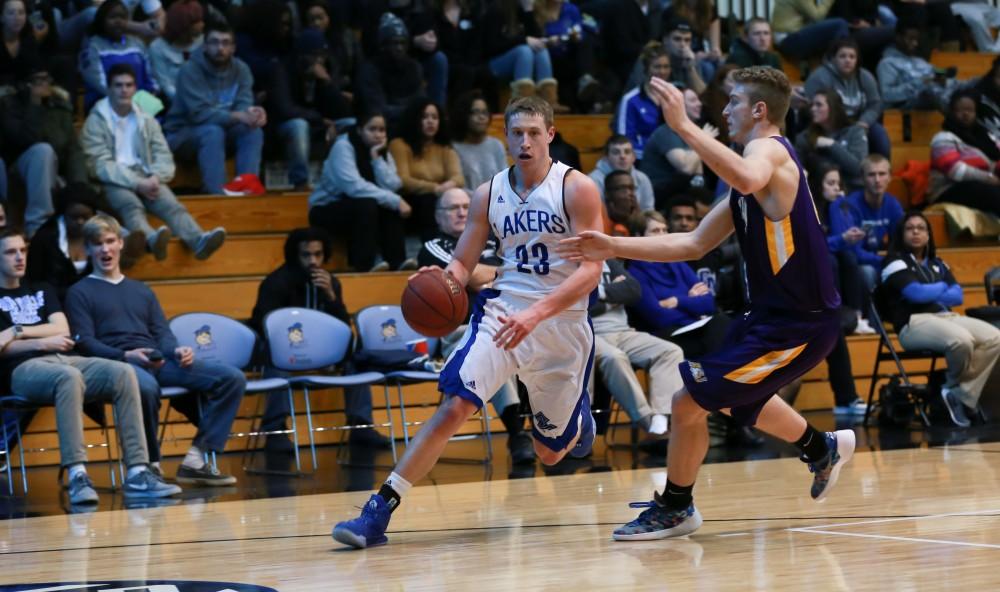 GVL / Kevin Sielaff - Luke Ryskamp (23) challenges the Ashland defense.  The Lakers fall to the Eagles of Ashland University in a tough overtime loss Dec. 3 in Allendale. The final score was 76-72.