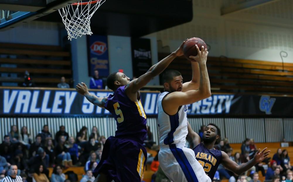 GVL / Kevin Sielaff - Ricardo Carbajal (32) is denied by the Ashland defense.  The Lakers fall to the Eagles of Ashland University in a tough overtime loss Dec. 3 in Allendale. The final score was 76-72.