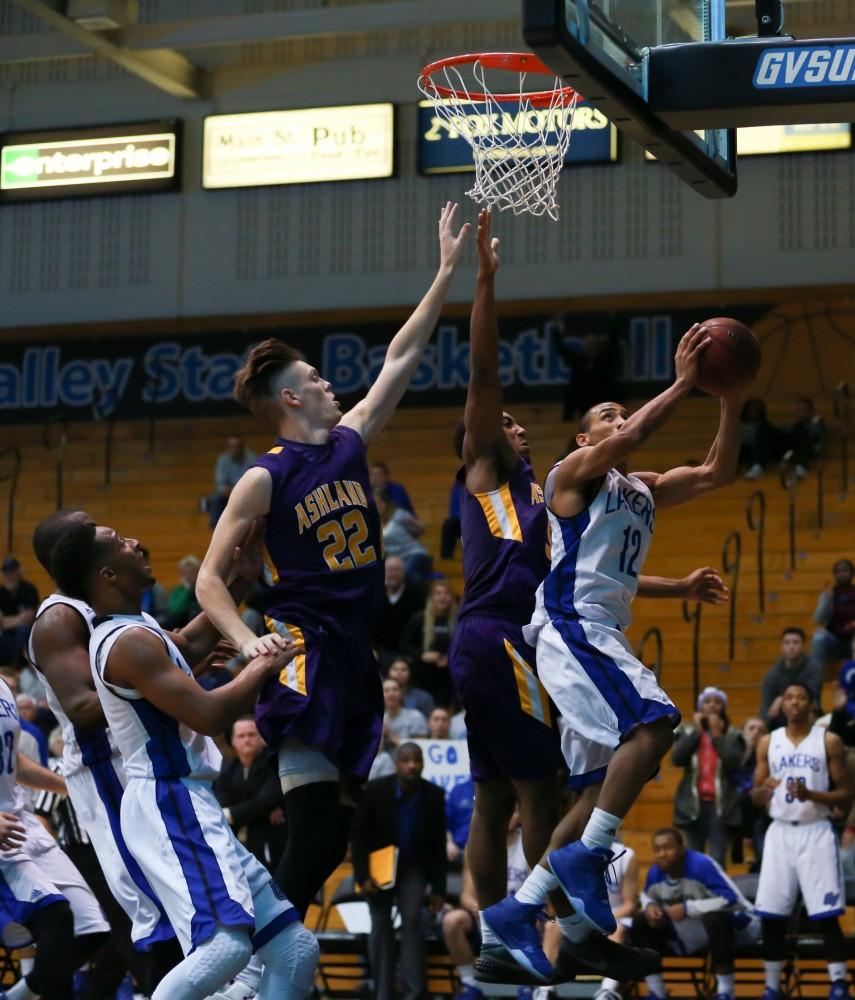 GVL / Kevin Sielaff - Myles Miller (12) powers to the net, but cannot convert.  The Lakers fall to the Eagles of Ashland University in a tough overtime loss Dec. 3 in Allendale. The final score was 76-72.