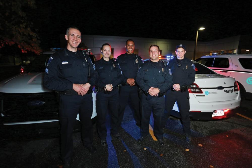GVL / Kevin Sielaff - The Saturday night patrol unit poses for a photo outside of the Grand Valley police station on Oct. 25. 