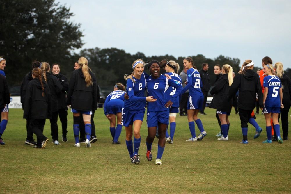 GVL / Emily Frye
Seniors Katie Klunder and Katy Bounds celebrate the Laker victory on Dec. 3rd. 