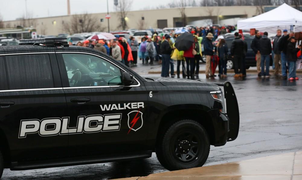 GVL / Kevin Sielaff -  The Walker Police Department controls the crowd as the parking lots begin to fill before the rally.  Republican front runner Donald Trump packs the Deltaplex Arena and Conference Center in downtown Grand Rapids Dec. 21 for a presidential rally. The event boasted the largest crowd ever held at the Deltaplex arena.