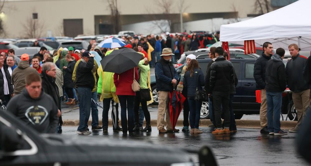 GVL / Kevin Sielaff - A crowd gathers in the parking lots before the rally begins.  Republican front runner Donald Trump packs the Deltaplex Arena and Conference Center in downtown Grand Rapids Dec. 21 for a presidential rally. The event boasted the largest crowd ever held at the Deltaplex arena.