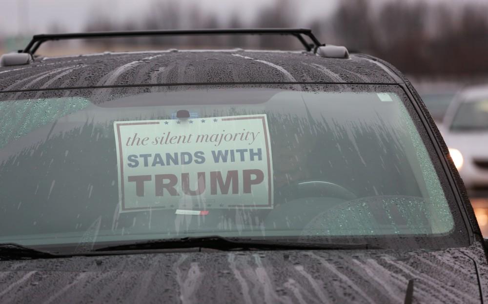 GVL / Kevin Sielaff - Various signs are seen throughout the parking lots in support of Donald Trump.  Republican front runner Donald Trump packs the Deltaplex Arena and Conference Center in downtown Grand Rapids Dec. 21 for a presidential rally. The event boasted the largest crowd ever held at the Deltaplex arena.