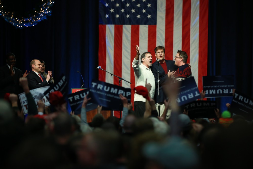 GVL / Kevin Sielaff - The event is opened by the signing of the national anthem.  Republican front runner Donald Trump packs the Deltaplex Arena and Conference Center in downtown Grand Rapids Dec. 21 for a presidential rally. The event boasted the largest crowd ever held at the Deltaplex arena.