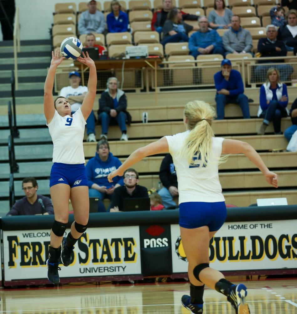 GVL / Kevin Sielaff - Katie Olson (9) sets the ball for Staci Brower (21).  The Lakers fall to the Flyers of Lewis University Dec. 3 in Big Rapids, MI in the first round of the NCAA midwest regional tournament by a margin of 3-1.