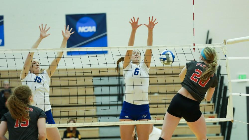 GVL / Kevin Sielaff - Betsy Ronda (6) goes up for a block as the balls flys over the net.  The Lakers fall to the Flyers of Lewis University Dec. 3 in Big Rapids, MI in the first round of the NCAA midwest regional tournament by a margin of 3-1.