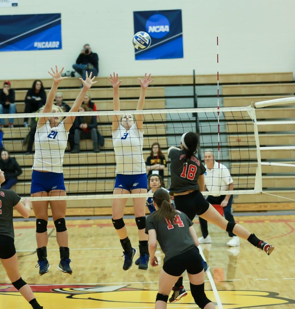 GVL / Kevin Sielaff - Jessica Majerle (3) and Staci Brower (21) go up for a block.  The Lakers fall to the Flyers of Lewis University Dec. 3 in Big Rapids, MI in the first round of the NCAA midwest regional tournament by a margin of 3-1.