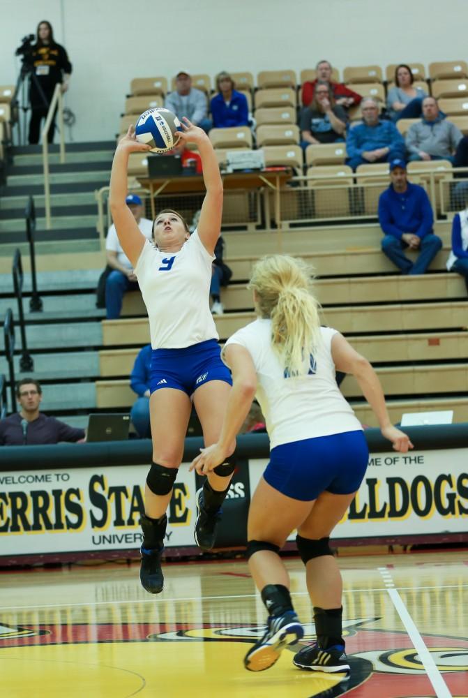 GVL / Kevin Sielaff - Katie Olson (9) sets the ball for Staci Brower (21).  The Lakers fall to the Flyers of Lewis University Dec. 3 in Big Rapids, MI in the first round of the NCAA midwest regional tournament by a margin of 3-1.