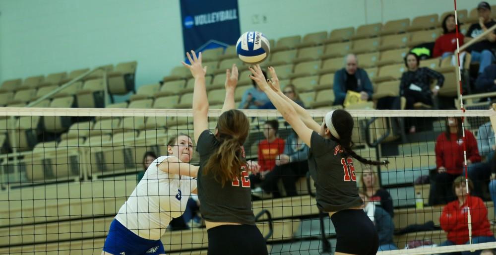 GVL / Kevin Sielaff - Jessica Majerle (3) attempts to push the ball through traffic.  The Lakers fall to the Flyers of Lewis University Dec. 3 in Big Rapids, MI in the first round of the NCAA midwest regional tournament by a margin of 3-1.