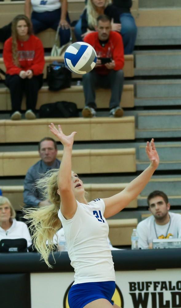 GVL / Kevin Sielaff - Staci Brower (21) elevates and prepares for a powerful hit.  The Lakers fall to the Flyers of Lewis University Dec. 3 in Big Rapids, MI in the first round of the NCAA midwest regional tournament by a margin of 3-1.