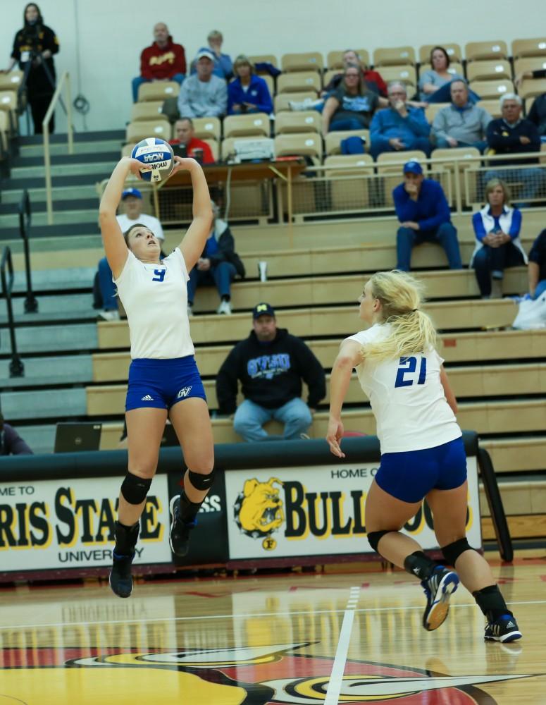 GVL / Kevin Sielaff - Katie Olson (9) sets the ball for Staci Brower (21).  The Lakers fall to the Flyers of Lewis University Dec. 3 in Big Rapids, MI in the first round of the NCAA midwest regional tournament by a margin of 3-1.