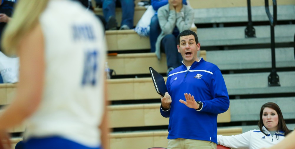 GVL / Kevin Sielaff - Jason Johnson, assistant head coach, attempts to calm the team down as the match starts slipping away.  The Lakers fall to the Flyers of Lewis University Dec. 3 in Big Rapids, MI in the first round of the NCAA midwest regional tournament by a margin of 3-1.