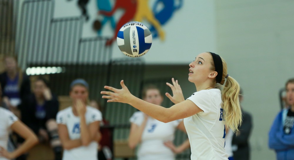 GVL / Kevin Sielaff - Kaylene Norris (4) sets the ball.  The Lakers fall to the Flyers of Lewis University Dec. 3 in Big Rapids, MI in the first round of the NCAA midwest regional tournament by a margin of 3-1.