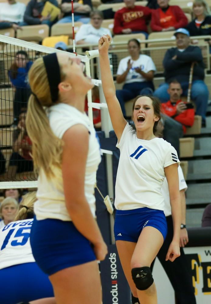 GVL / Kevin Sielaff - Kourtney Wolters (11) celebrates a point scored.  The Lakers fall to the Flyers of Lewis University Dec. 3 in Big Rapids, MI in the first round of the NCAA midwest regional tournament by a margin of 3-1.