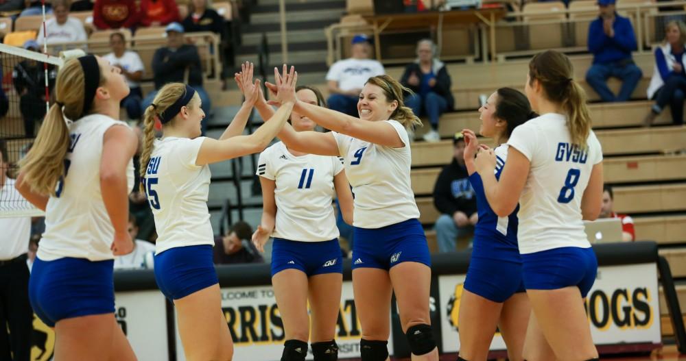 GVL / Kevin Sielaff - Katie Olson (9) celebrates a point scored.  The Lakers fall to the Flyers of Lewis University Dec. 3 in Big Rapids, MI in the first round of the NCAA midwest regional tournament by a margin of 3-1.