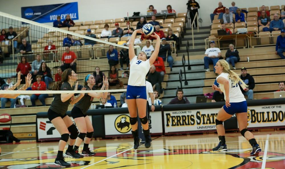 GVL / Kevin Sielaff - Katie Olson (9) sets the ball.  The Lakers fall to the Flyers of Lewis University Dec. 3 in Big Rapids, MI in the first round of the NCAA midwest regional tournament by a margin of 3-1.