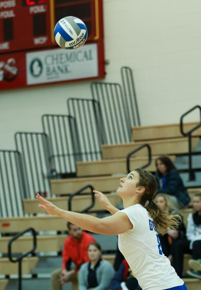 GVL / Kevin Sielaff - Brooke Smith (8) serves the ball.  The Lakers fall to the Flyers of Lewis University Dec. 3 in Big Rapids, MI in the first round of the NCAA midwest regional tournament by a margin of 3-1.