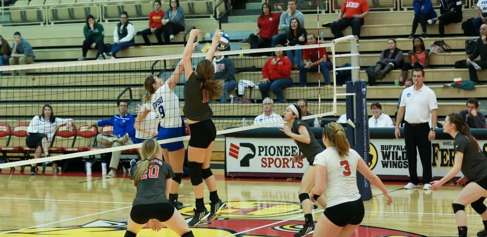 GVL / Kevin Sielaff - Katie Olson (9) battles at the net to earn the point.  The Lakers fall to the Flyers of Lewis University Dec. 3 in Big Rapids, MI in the first round of the NCAA midwest regional tournament by a margin of 3-1.