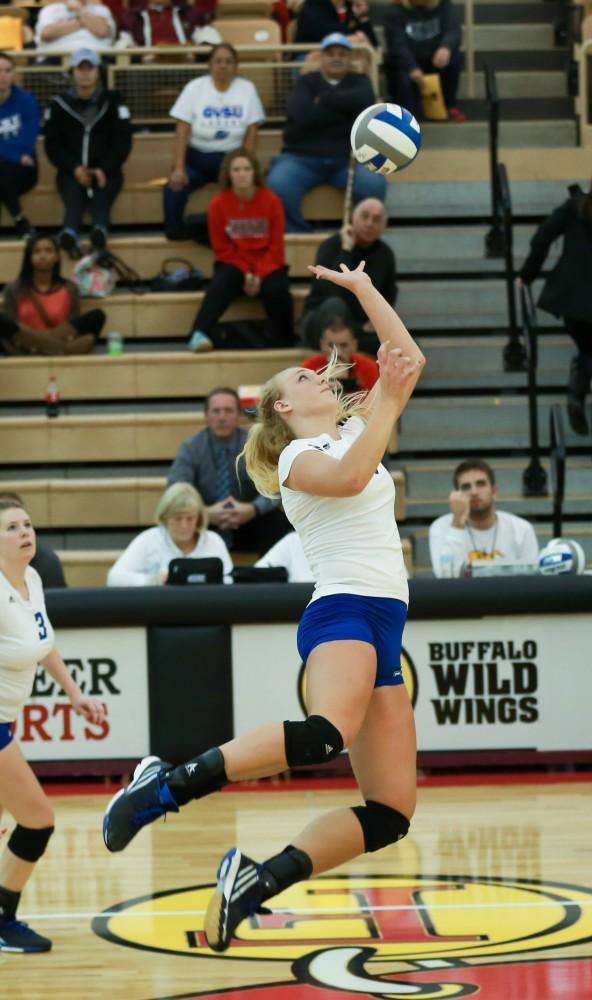 GVL / Kevin Sielaff - Staci Brower (21) looks to tip the ball over the net.  The Lakers fall to the Flyers of Lewis University Dec. 3 in Big Rapids, MI in the first round of the NCAA midwest regional tournament by a margin of 3-1.