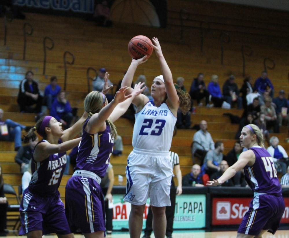 Kayla Dawson, junior, jumps to make a basket in the Women’s Basketball game on Dec. 3 in Allendale, MI. 
