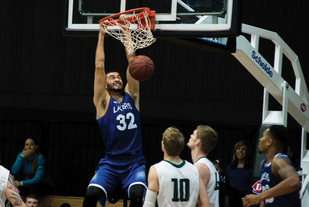 GVL/Luke HolmesRicardo Carbajal (no.32) slams the ball down for the dunk. The Lakers lost to Lake Erie College 78-84 on Dec. 5.