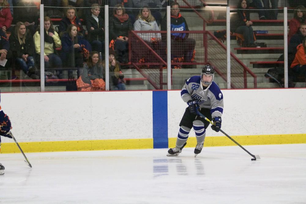 GVL / Sara Carte
Grand Valley Men’s Ice Hockey D3 player, Alex Bjork, runs the puck down the ice against Hope College at the Georgetown Ice Arena on Jan 16. 