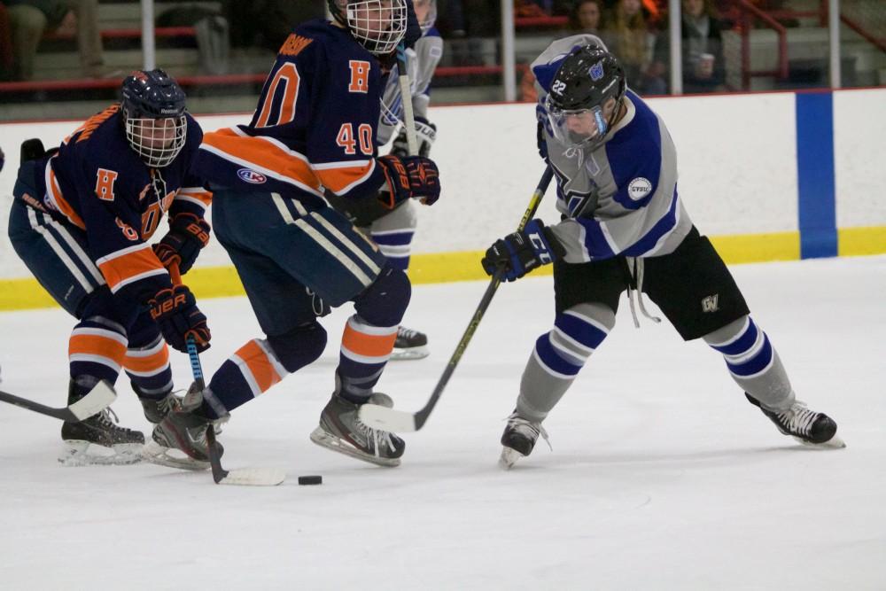 GVL / Sara Carte
Grand Valley Men’s Ice Hockey D3 player, Alex Bjork, fights for the puck against Hope College at the Georgetown Ice Arena on Jan 16.