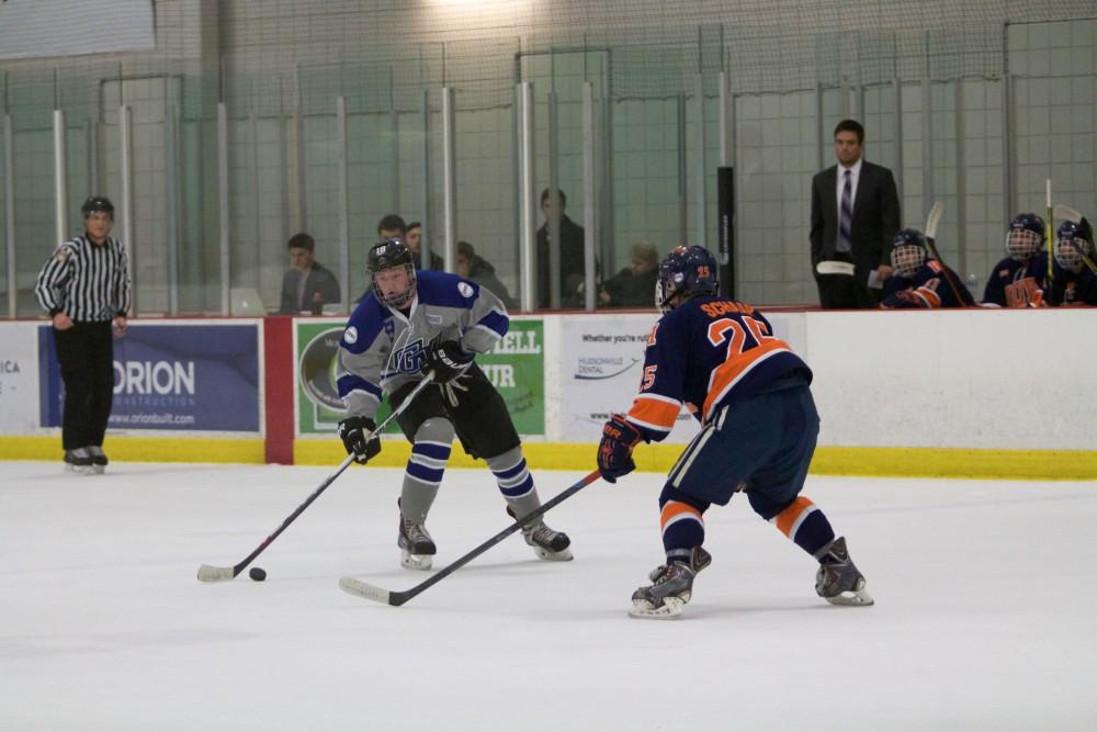 GVL / Sara Carte
Grand Valley Men’s Ice Hockey D3 player, Eric White, runs the puck down the ice against Hope College at the Georgetown Ice Arena on Jan 16.