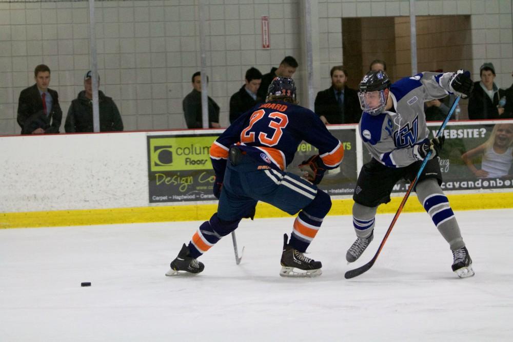 GVL / Sara Carte
Grand Valley Men’s Ice Hockey D3 player, Blaine Marney, fights for the puck against Hope College at the Georgetown Ice Arena on Jan 16.