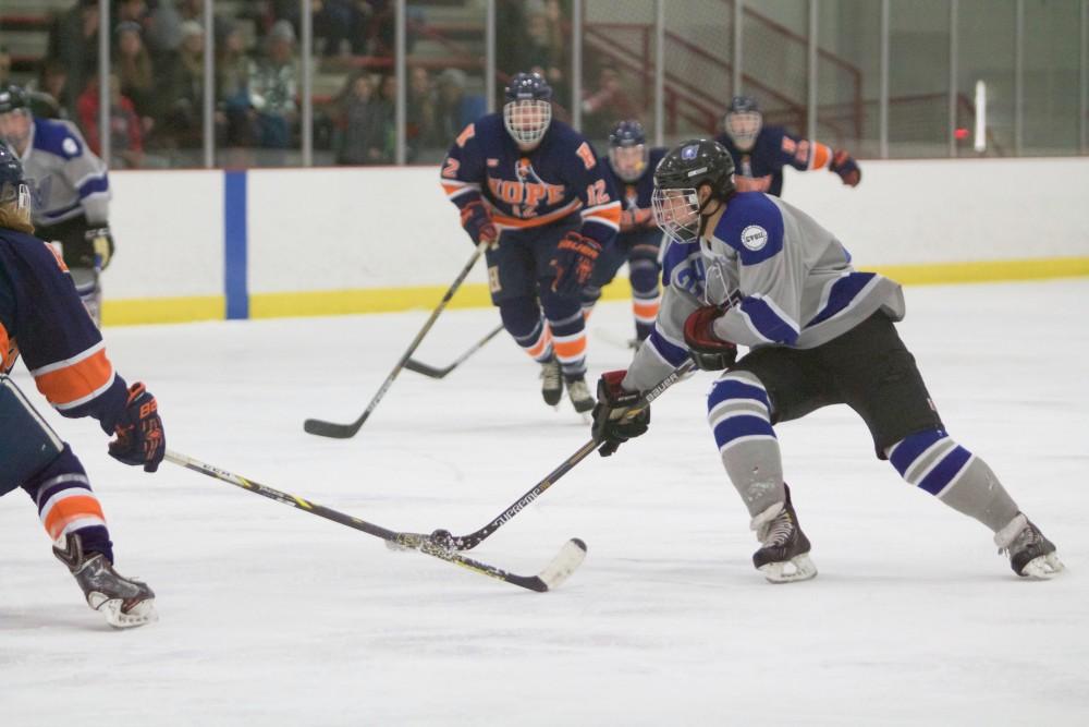 GVL / Sara Carte
Grand Valley Men’s Ice Hockey D3 player, Mitch Kahl, runs the puck down the ice against Hope College at the Georgetown Ice Arena on Jan 16. 