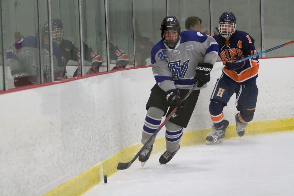 GVL / Sara Carte
Grand Valley Men’s Ice Hockey D3 player, Mitch Lawton, runs the puck down the ice against Hope College at the Georgetown Ice Arena on Jan 16. 