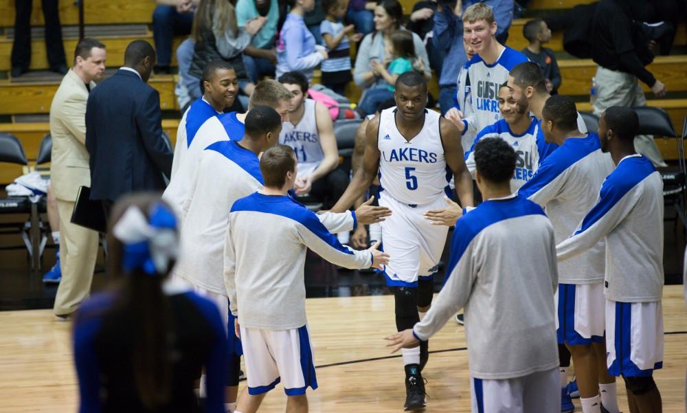 GVL / Kevin Sielaff - Trevin Alexander (5) runs onto the court before the match.  The Lakers defeat the Chargers of Hillsdale College Saturday, Jan. 30, 2016 in Allendale.