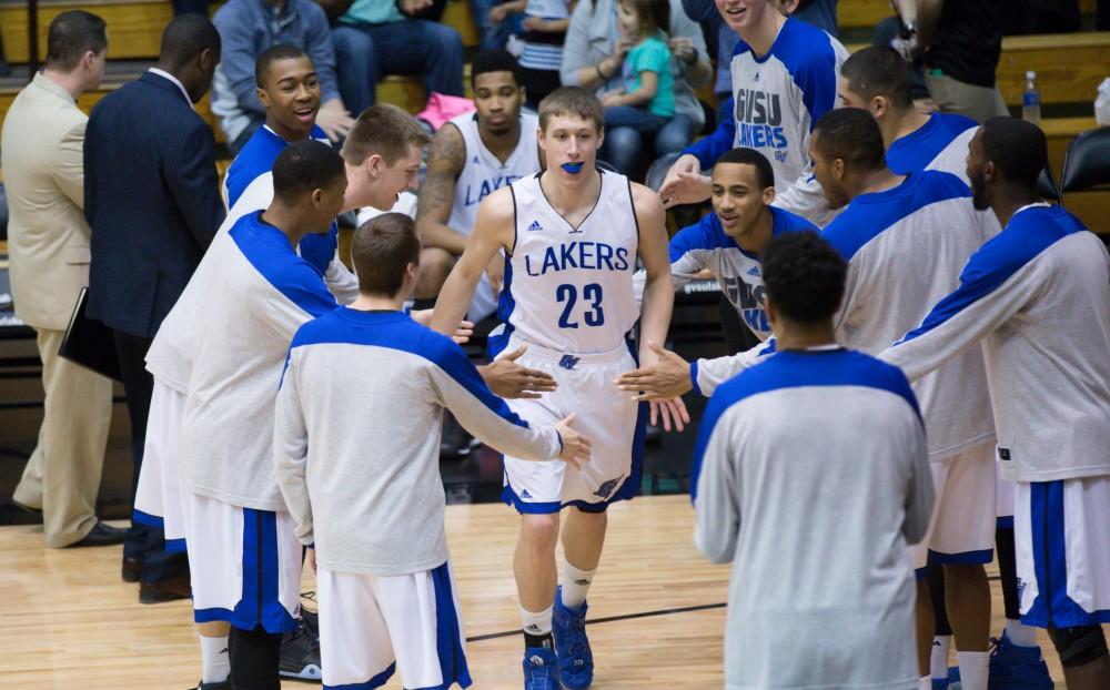 GVL / Kevin Sielaff - Luke Ryskamp (23) runs onto the court before the match.  The Lakers defeat the Chargers of Hillsdale College Saturday, Jan. 30, 2016 in Allendale.