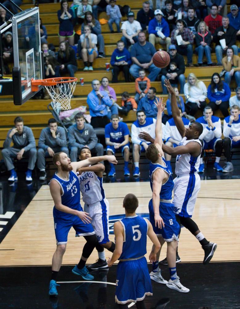 GVL / Kevin Sielaff - Trevin Alexander (5) jumps up with a floater in the paint.  The Lakers defeat the Chargers of Hillsdale College Saturday, Jan. 30, 2016 in Allendale.