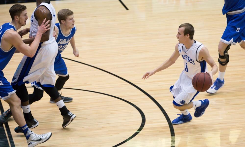 GVL / Kevin Sielaff - Darren Kapustka (3) drives the ball in on net.  The Lakers defeat the Chargers of Hillsdale College Saturday, Jan. 30, 2016 in Allendale.