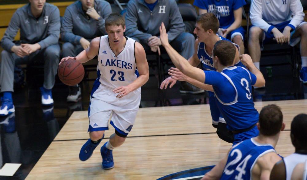 GVL / Kevin Sielaff - Luke Ryskamp (23) drives the ball down the baseline.  The Lakers defeat the Chargers of Hillsdale College Saturday, Jan. 30, 2016 in Allendale.