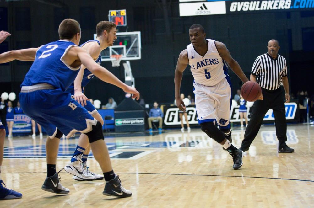 GVL / Kevin Sielaff - Trevin Alexander (5) drives on net.  The Lakers defeat the Chargers of Hillsdale College Saturday, Jan. 30, 2016 in Allendale.