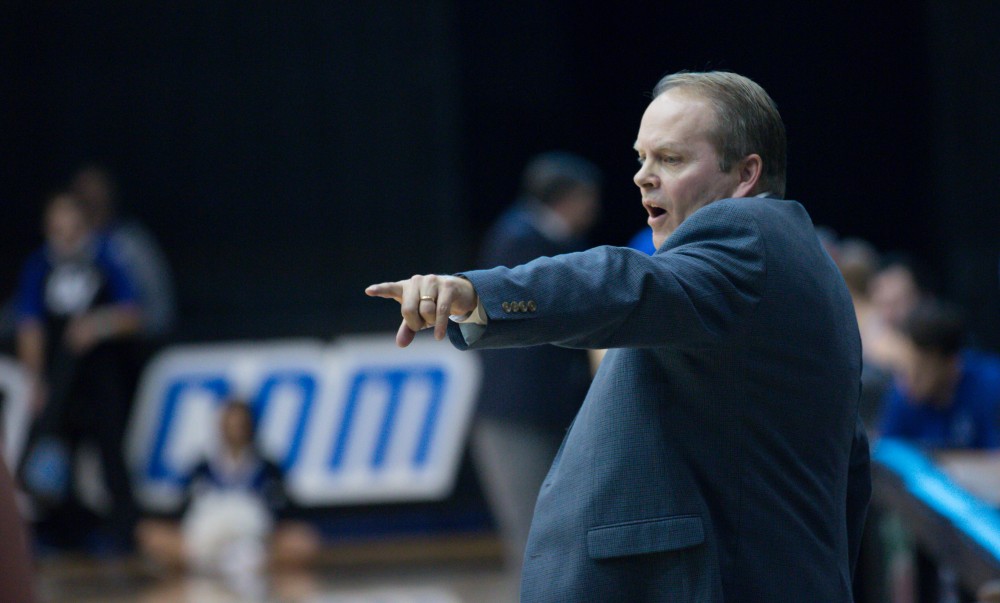 GVL / Kevin Sielaff - Head coach Ric Wesley calls for a foul.  The Lakers defeat the Chargers of Hillsdale College Saturday, Jan. 30, 2016 in Allendale.