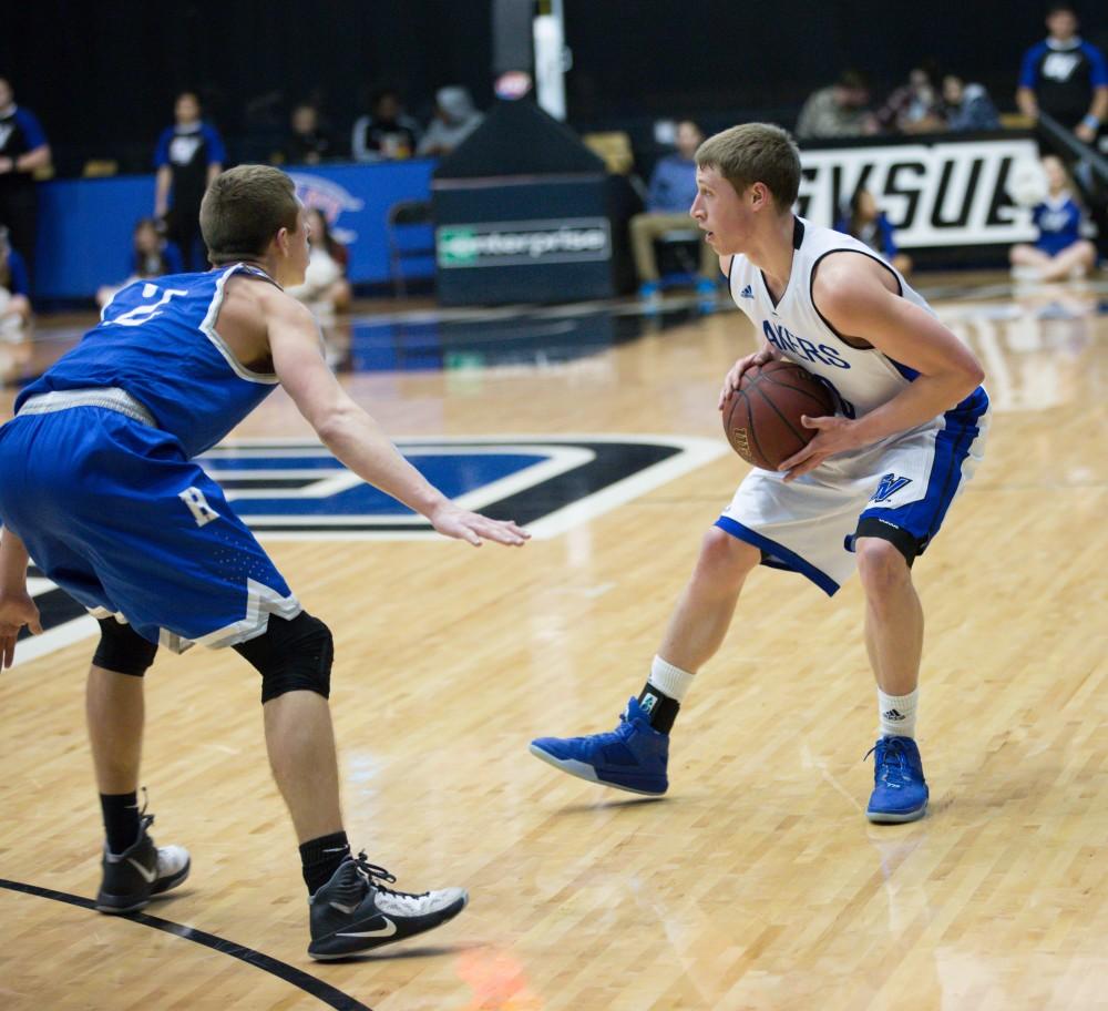 GVL / Kevin Sielaff - Luke Ryskamp (23) picks up his dribble and looks to pass the ball.  The Lakers defeat the Chargers of Hillsdale College Saturday, Jan. 30, 2016 in Allendale.