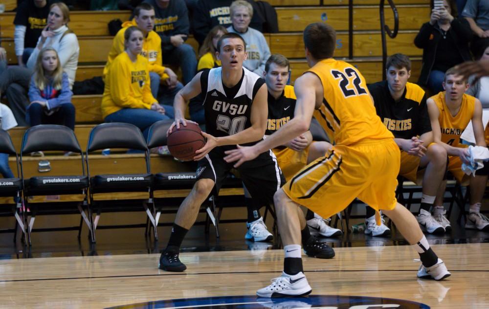 GVL / Kevin Sielaff - Alec Marty (20) looks for an outlet pass around the three point line.  The Lakers defeat the Huskies of Michigan Tech with a final score of 64-53 Jan. 17, 2016 in Allendale.