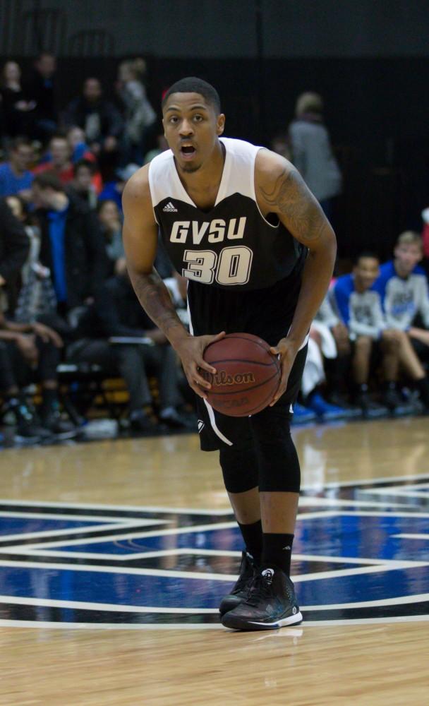 GVL / Kevin Sielaff - Deshawn Lewis (3) possesses the ball and looks to pass.  The Lakers defeat the Huskies of Michigan Tech with a final score of 64-53 Jan. 17, 2016 in Allendale.