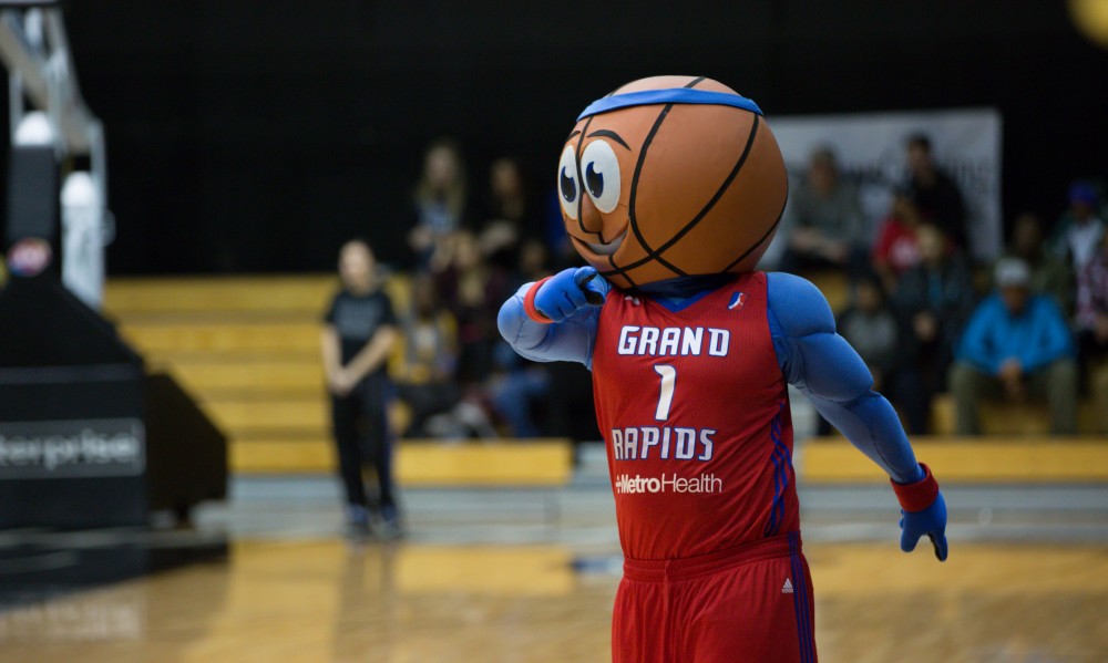 GVL / Kevin Sielaff - The Grand Rapids Drive mascot cheers on the Lakers from the court and the stands during the match and intermissions.  The Lakers defeat the Huskies of Michigan Tech with a final score of 64-53 Jan. 17, 2016 in Allendale.